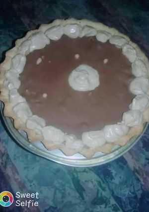 Una foto de Tarta de Crema Moka y Chocolate...😍😍😍