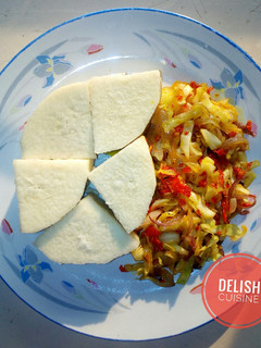 A picture of Boiled yam and cabbage sauce.