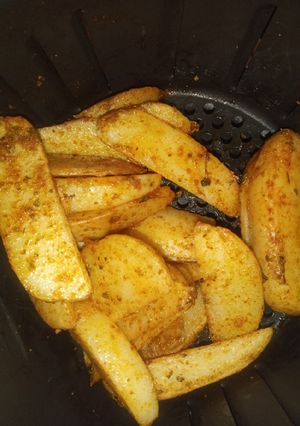 Una foto de Papas en gajos estilo pizzería