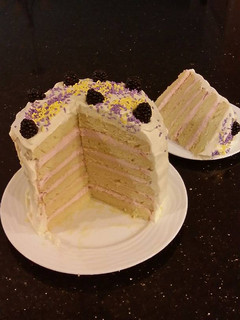 A picture of Lemon Layer Cake with Blackberrie Cream Filling and a Lemon Cream Frosting.