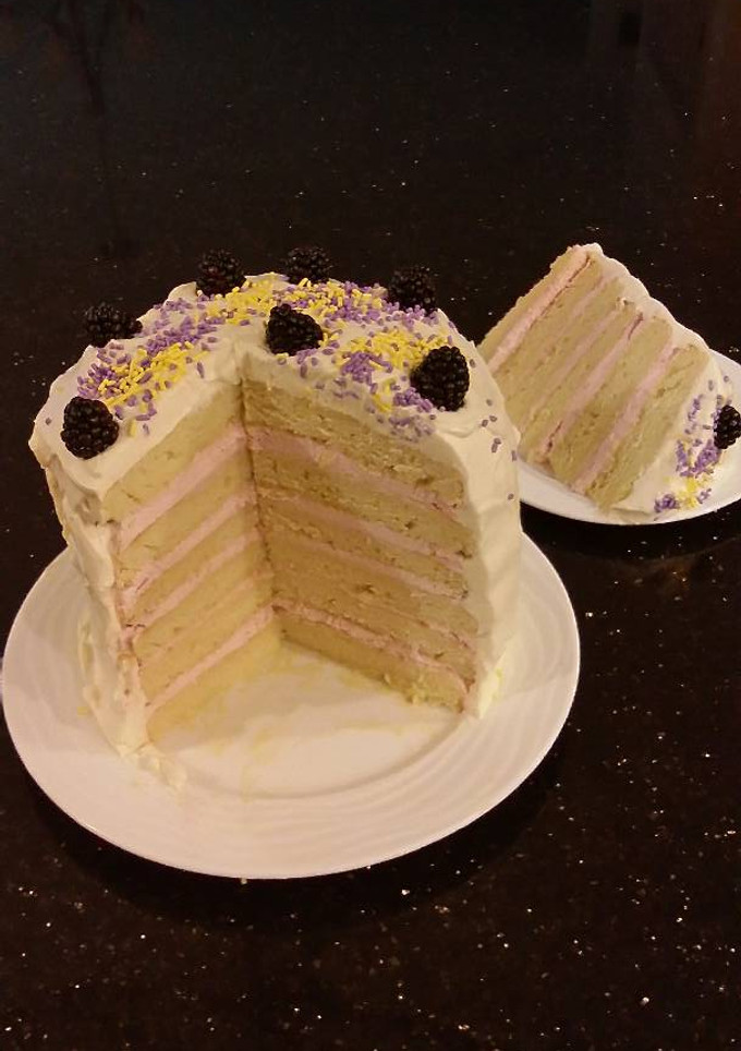 A picture of Lemon Layer Cake with Blackberrie Cream Filling and a Lemon Cream Frosting.