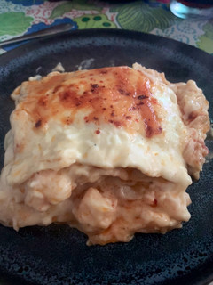 Una foto de Lasaña de Gambón al ajillo con bechamel y parmesano
