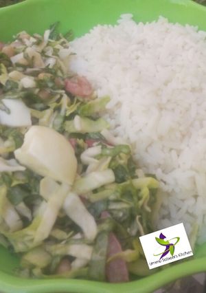 A picture of White rice with cabbage sallad.