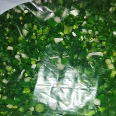 A picture of Green Spring Onions And Green Garlic.