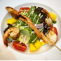 A picture of Lime, chilli prawns on mango salad.