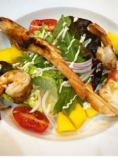 A picture of Lime, chilli prawns on mango salad.