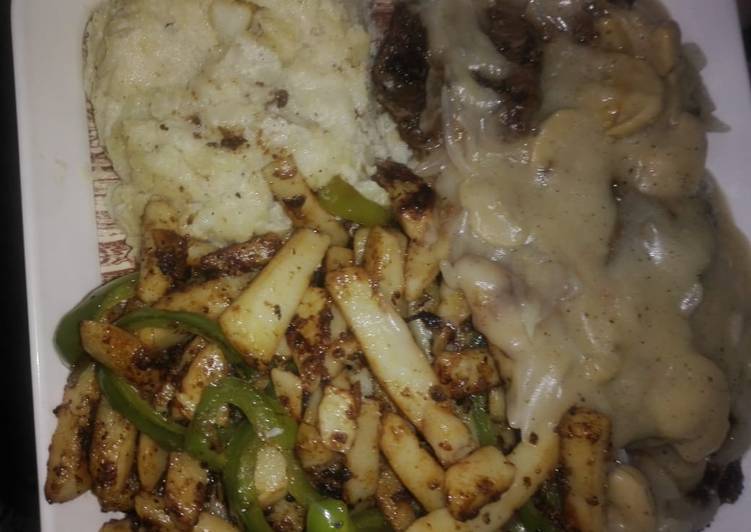 Lamb steak with mushroom sauce stir fried vegis and mashed potatoes