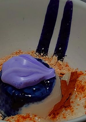Una foto de Panna Cotta de coco y zarzamora