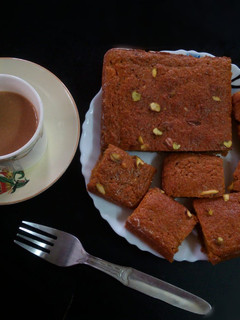 A picture of Orange flavoured carrot pistachios cake.