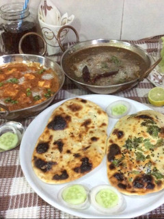 A picture of Dal Makhani Restaurant style,Shahi Paneer,butter Naan & garlic Naan.