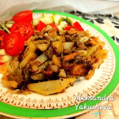 A picture of Fried potatoes with wild mushrooms.