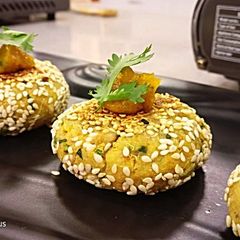 A picture of Shakarkandi akhroth Shammi with khubani gel chutney.