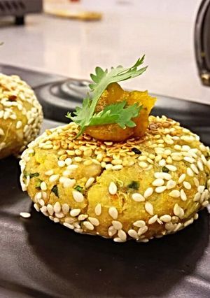A picture of Shakarkandi akhroth Shammi with khubani gel chutney.