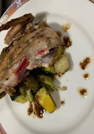 A picture of Green herbed grilled chicken with oven roasted vegetables.
