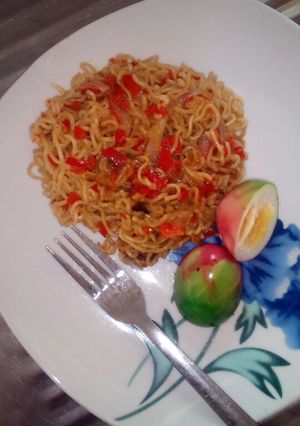 A picture of Indomie with boiled coloured egg.
