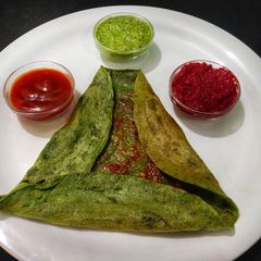 A picture of Milti Grain-Spinach Dosa.