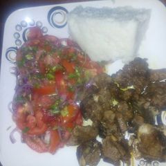 A picture of Kachumbari with fried meat.