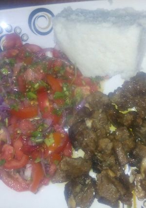 A picture of Kachumbari with fried meat.