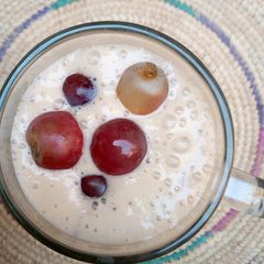 A picture of Apple,banana and grapes smoothie.