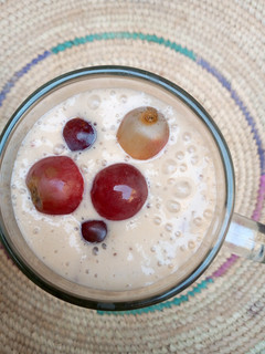 A picture of Apple,banana and grapes smoothie.