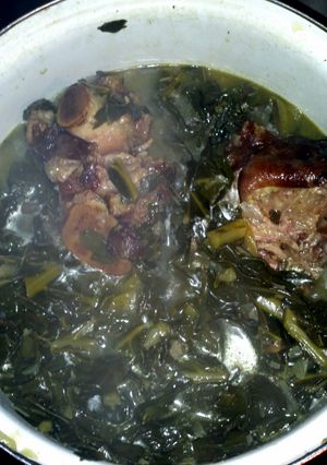 A picture of Smack ya Mama Collard greens with smoke meat.