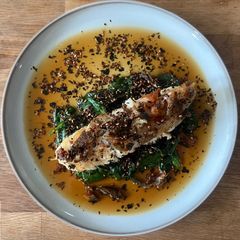 A picture of Norwegian Halibut on the Bone with Asian-flavoured Spinach.