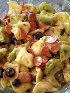 A picture of mixed cheese tortillini pasta salad.