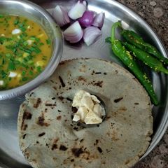 A picture of Bajara ki roti with moong dal.
