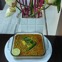 A picture of Mutton mince with green peas potato.