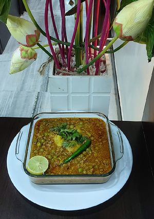 A picture of Mutton mince with green peas potato.