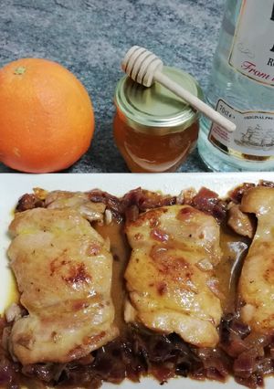 Una foto de Pollo al ron con miel y naranjas