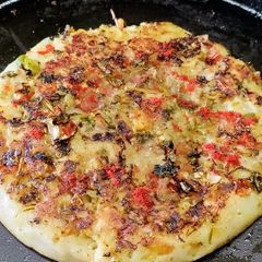 Onion and Tomato Uttapam A picture of Onion and Tomato Uttapam.