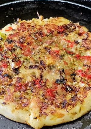 A picture of Onion and Tomato Uttapam.