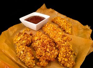 Una foto de Solomillos de pollo con kikos {al horno}