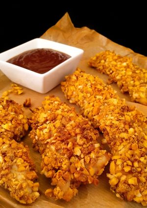 Foto principal de Solomillos de pollo con kikos {al horno}