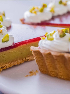 A picture of Strawberry & Pistachio Custard Tart.