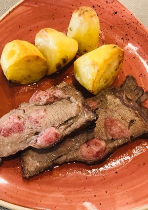 Una foto de Punta de picana mechada con tocino