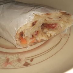 A picture of Chicken paratha roll with lemon cupcakes.