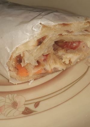 A picture of Chicken paratha roll with lemon cupcakes.