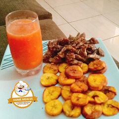 A picture of Carrot drink with fried plantain and fried beef.