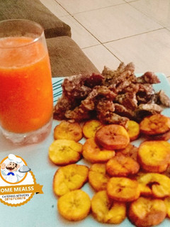 A picture of Carrot drink with fried plantain and fried beef.