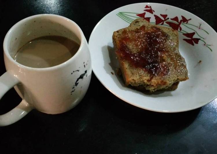 Sliced bread with jam and coffee