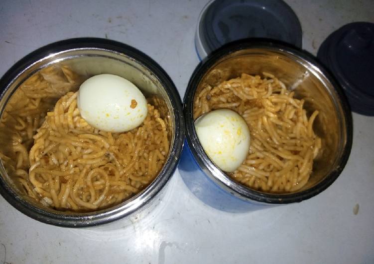 Jollof spaghetti and boiled egg