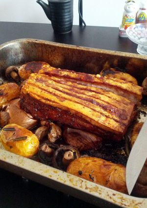 A picture of Roast pork belly with herb infused roast new potatoes and spring greens.