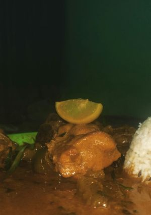 A picture of Northern style chicken curry with zeera rice.