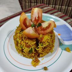 A picture of Tomato vegetable pulao.