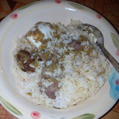 A picture of White rice and gbadun stew.