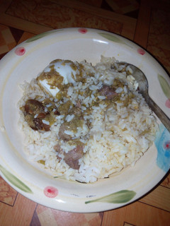 A picture of White rice and gbadun stew.