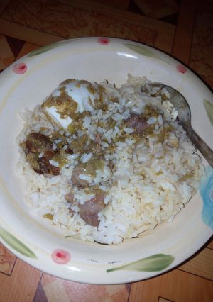 A picture of White rice and gbadun stew.