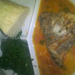 A picture of Fish stew and fried kales.